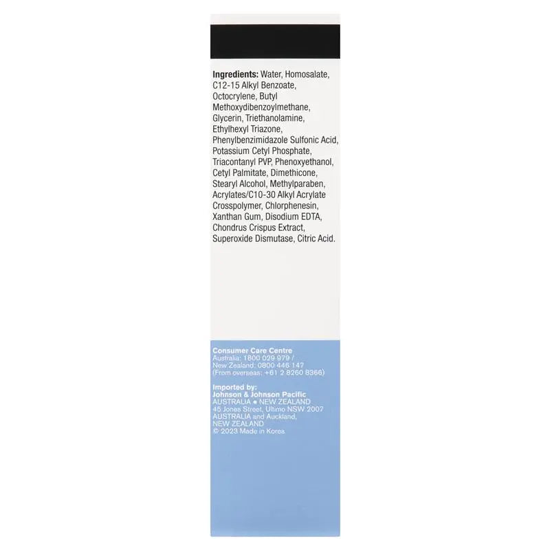 A tall, narrow white product box or package insert with a black rectangular area at the top and printed ingredient text, plus a light blue section at the bottom with company and import information.